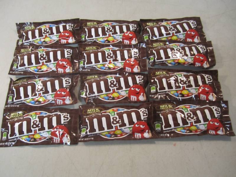 lot 192 image: 12 Bags of M&Ms Best by Nov 2018  ...