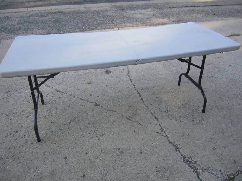 lot 239 image: 6 Foot Folding Table Sets up fine, ...