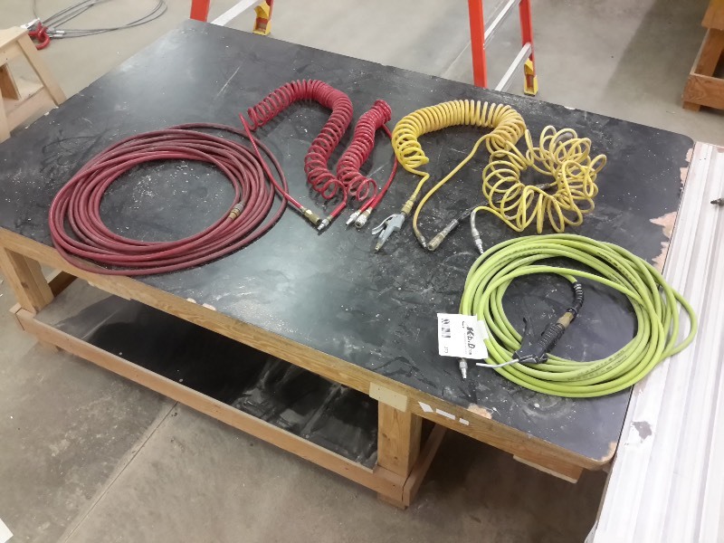 lot 373 image: 5 Air Hoses  3, Coiled  2, Approx  25 ft.. Air nozzels as pictured