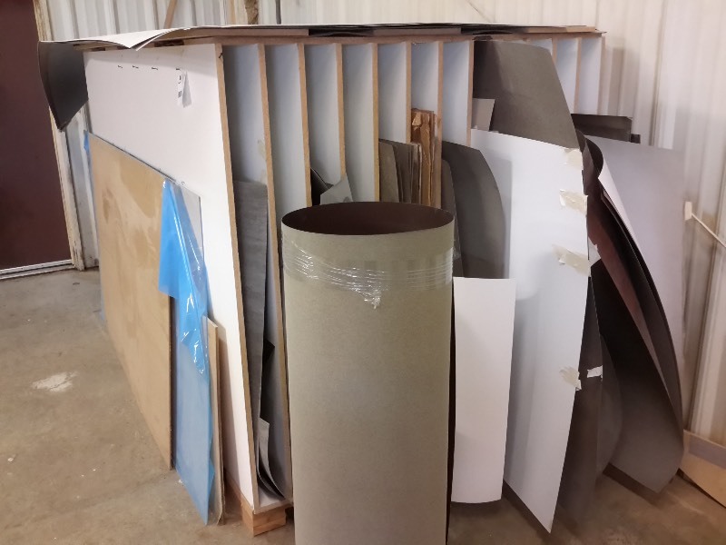 lot 348 image: Upright Material Storage shelf with Laminate in it.  Please inspect. 56in w x 67 in h x 97 in deep.. Bring your own loading help