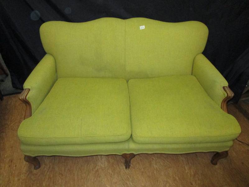 54 long green couch with nice wood features