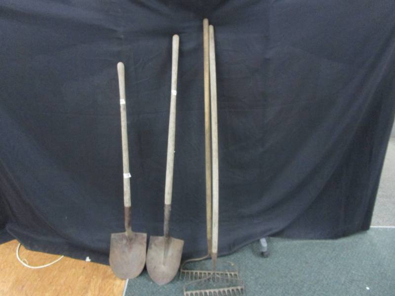 2 rakes and 2 spadesshovels