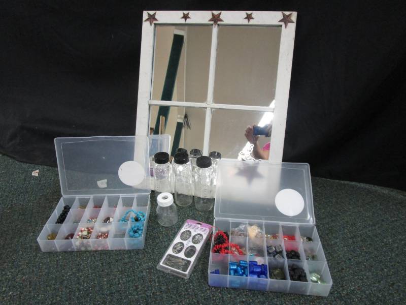 Mirror, beads and glass baby bottles