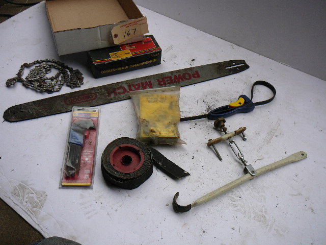 lot 167 image: Chain Saw Sharpener, Chain Saw Blades and Bar Allen Wrench Set Spare Tire Bracket Misc.