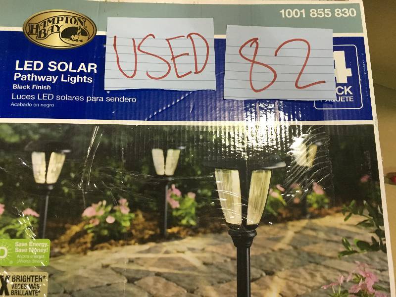 lot 82 image: Solar Black Outdoor Integrated LED 3000K 30-Lumens Landscape Path Light with Glass Lens (4-Pack)  Used in good working cond.