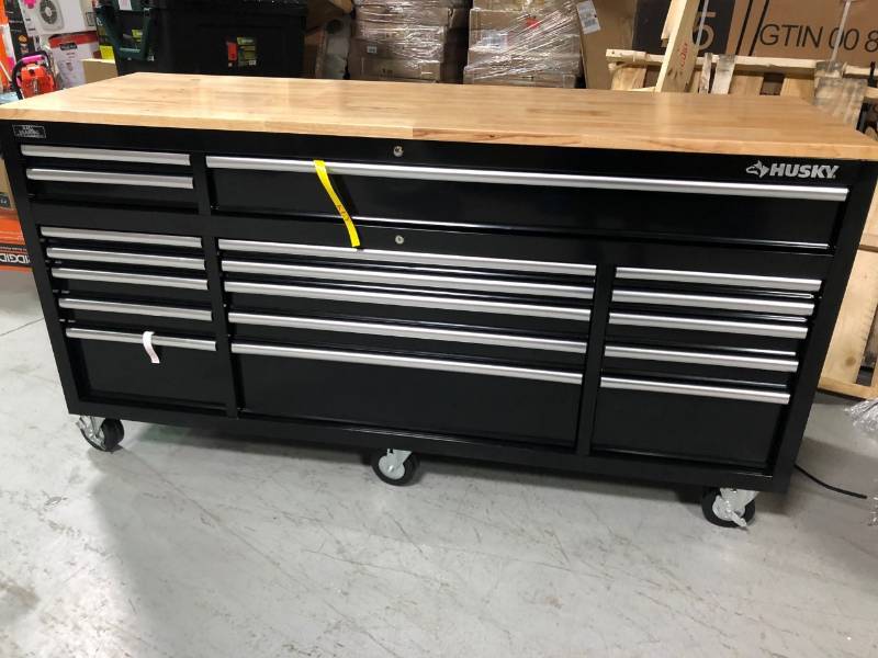 lot 102 image: Husky 72 in. 18-Drawer Mobile Workbench with Solid Wood Top, Black not used