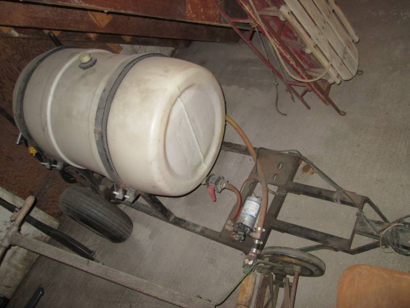 lot 1 image: 50 gal 12 volt tank sprayer with tr...