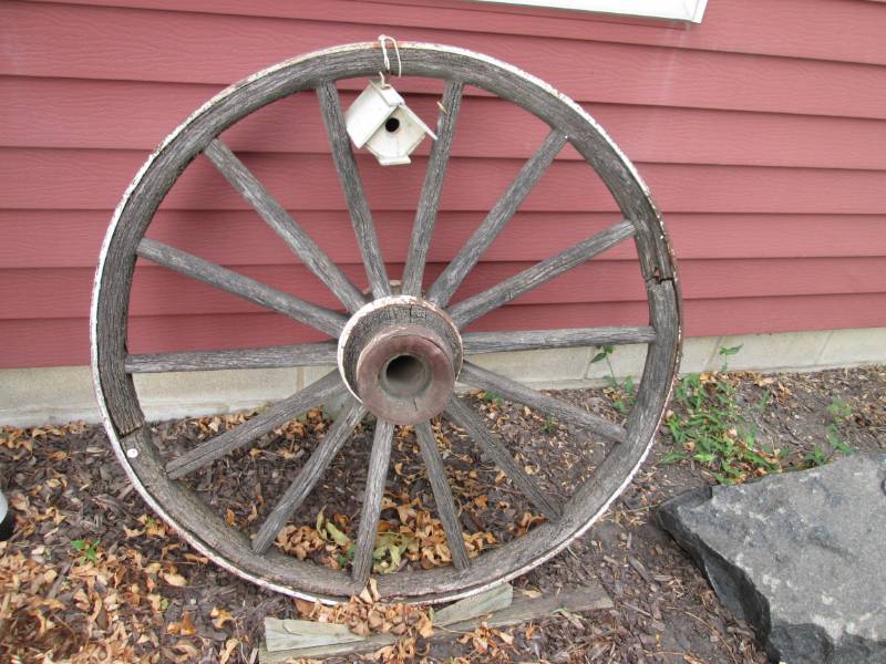 lot 51 image: Antique wooden wagon wheel...