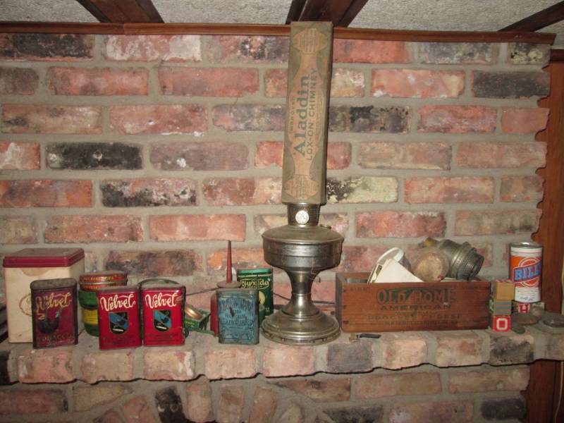 lot 77 image: Antique oil lamptobacco containers...