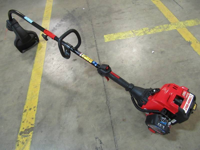 lot 29 image: Troy-Bilt 25-cc 2-cycle 17-in Trimmer Plus Attachment Compatible Curved Shaft Gas String Trimmer and Edger