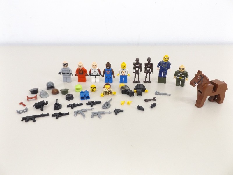 lot 47 image: Collection of Vintage Lego Mini Figures, parts, Weapons, etc.