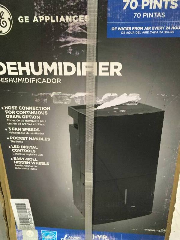 lot 2 image: GE 70 Pint Dehumidifier With Built-In Pump - APER70LW not used