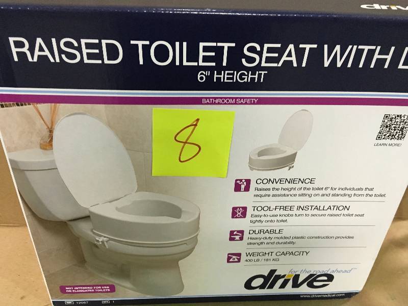 lot 8 image: Drive Medical Raised Toilet Seat with Lock and Lid, Standard Seat not used