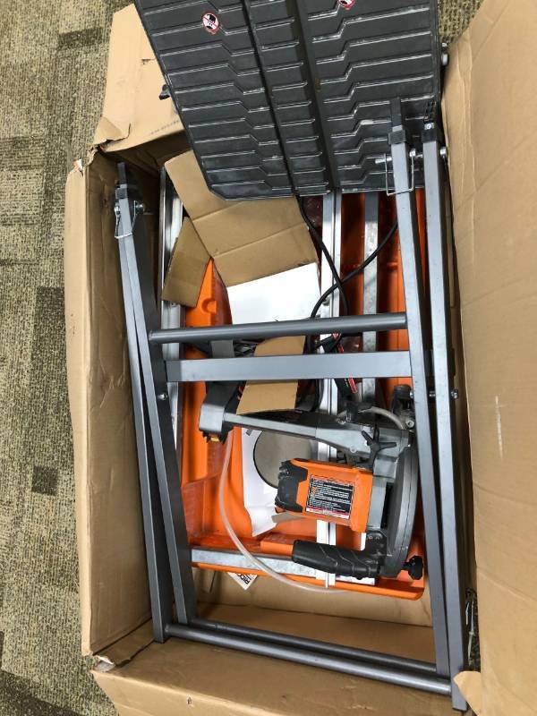 lot 113 image: Ridgid 7 in Tile saw with stand used in very good condition