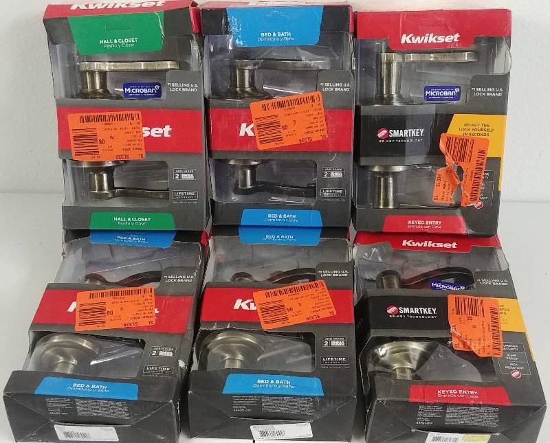 lot 44 image: Kwikset Antique Brass Lever Handle locksets. Grouping of 6
