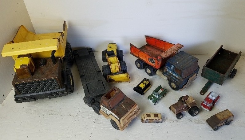 lot 42 image: Tonga Trucks, ERTL, & Nylint sand box toys