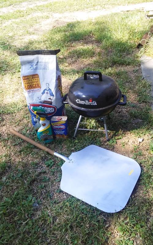 lot 26 image: Mini Char-Broil Grill, Bag Of Charcoal, Pizza Paddle, Charcoal Lighter, Grill Cleaner