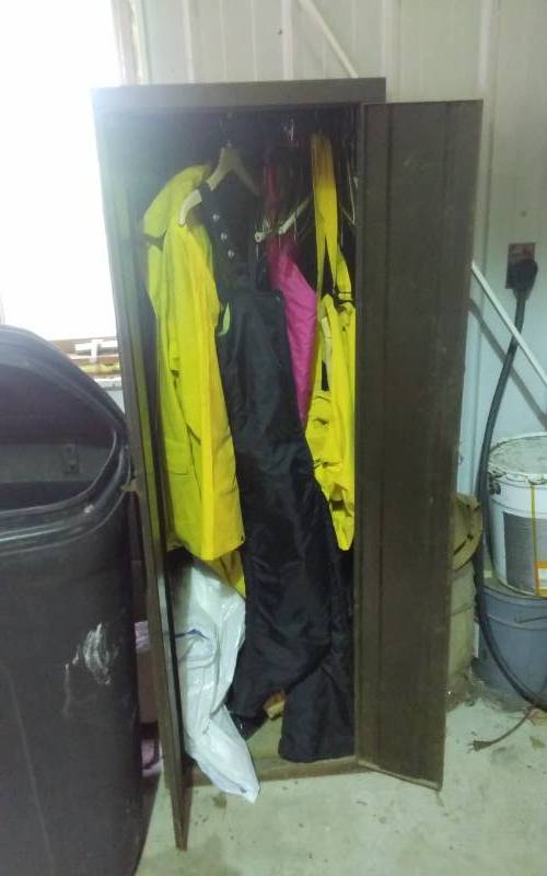 lot 173 image: Metal ClosetCabinet 20x18x61 Includes Contents Rain Suit, Arctic Cat Snow Pants, Boot Dryer, More