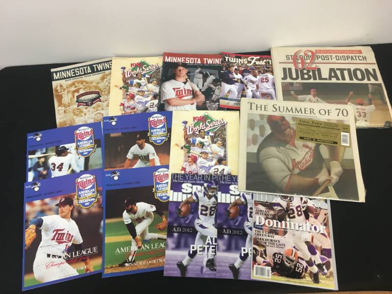 lot 57 image: Minnesota Twins Lot - Programs, Sports Illustrated, and News Paper articles