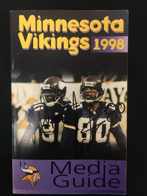 lot 59 image: Minnesota Vikings Chris Carter & Jake Reed 1998 Autographed Media Guide