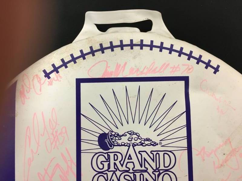 lot 106 image: Grand Casino Milacs Seat Cushion Autographed Minnesota Vikings  Jim Marshall, Mick Tingelhoff and more....