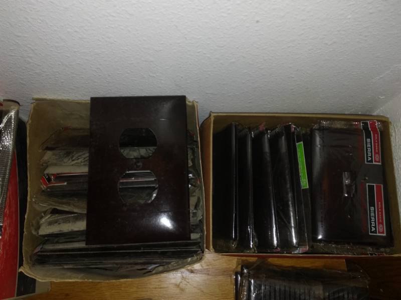 lot 86 image: Brown electrical faceplates approximately 100