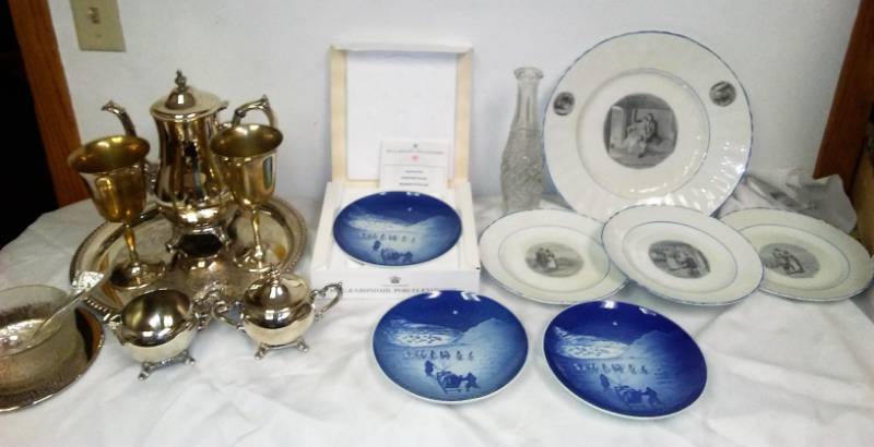 lot 16 image: International Silver Company Silver Service set, Duo server, Oneida, Bing and Grondahl Christmas plates and tote.