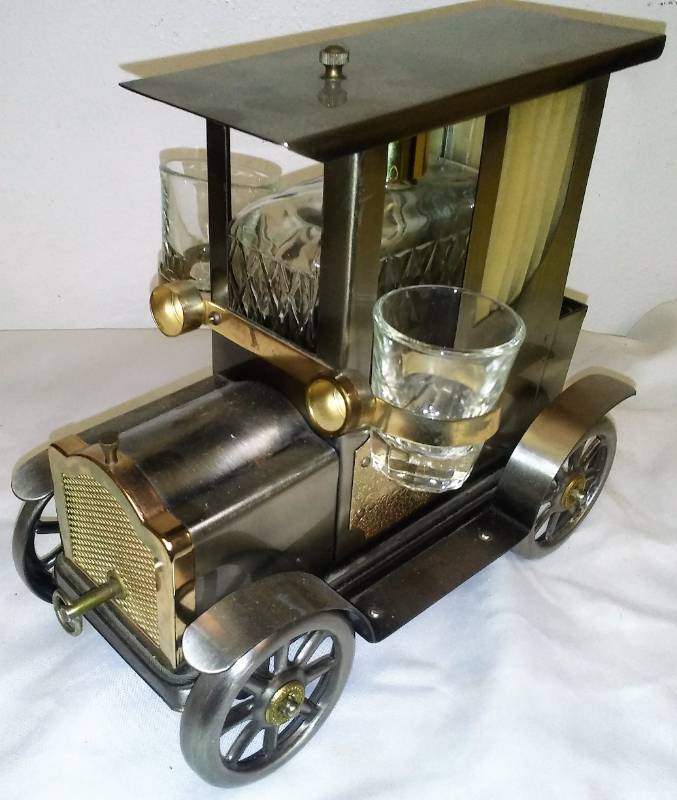 lot 51 image: Ford brandy bottle and two shot glasses
