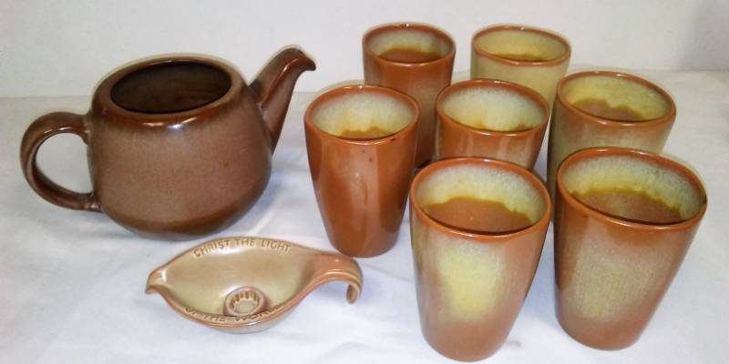 lot 79 image: Frankoma Tumblers (7), Tea Pot and Oral Roberts candle holder.