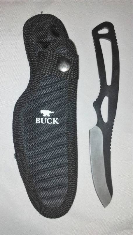 lot 82 image: Buck knife, #135, in nylon belt sheath.