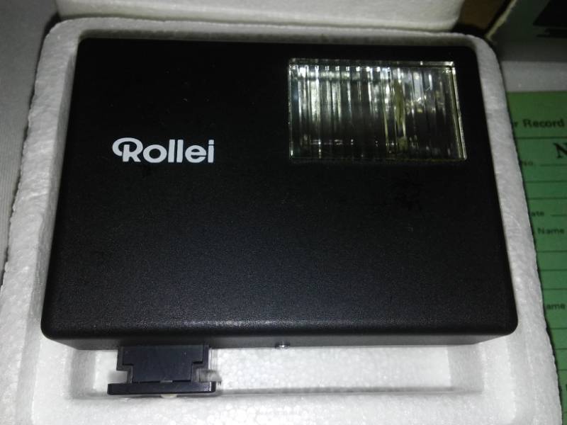 lot 144 image: Complete Konica C35 camera and Rollei E15B flash