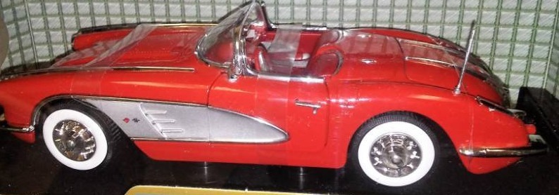 lot 151 image: 1958 Chevy Corvette red  silver coves.