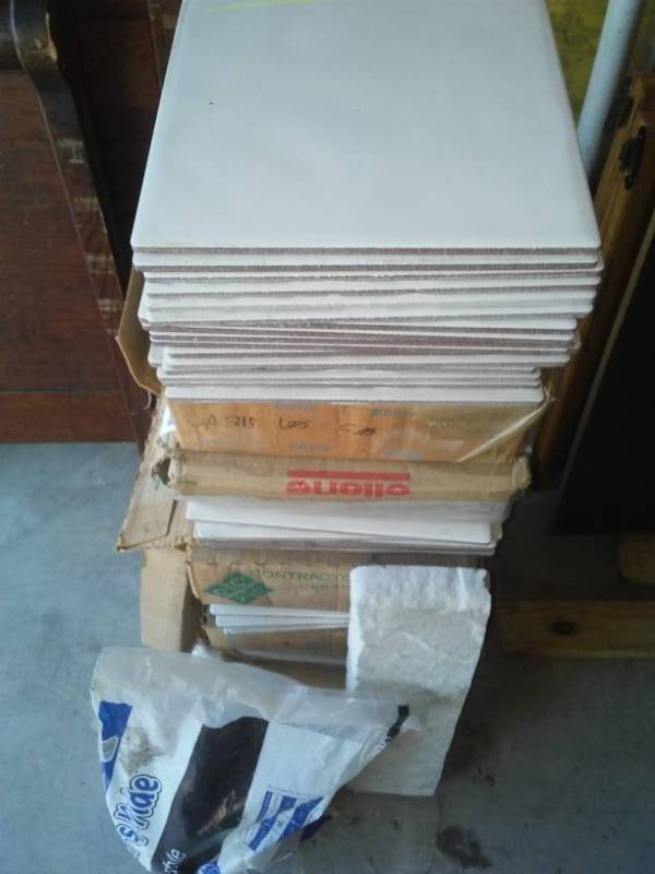 lot 171 image: Approximately 10 plus cases ceramic tile, marble remnants, and marble stones. 11.75 x 11.75 tile measurements.