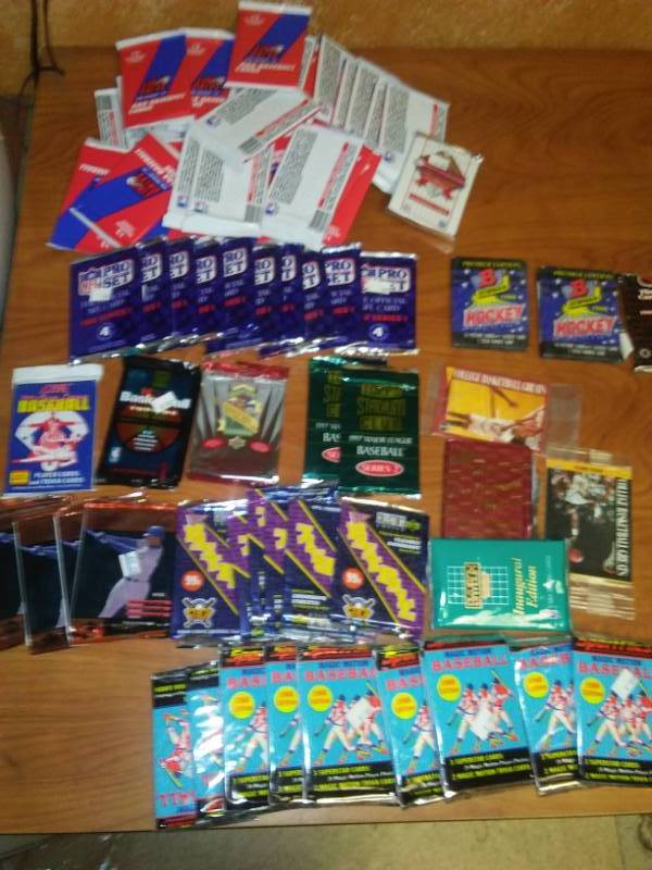 Over six dozen wax packs. Baseball, NFL, hockey, basketball.