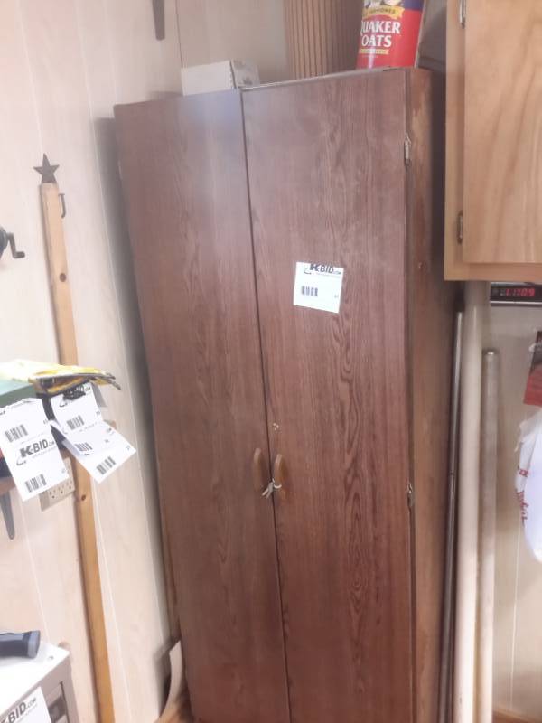 lot 47 image: Tall Upright Storage Cabinet with Everything Inside