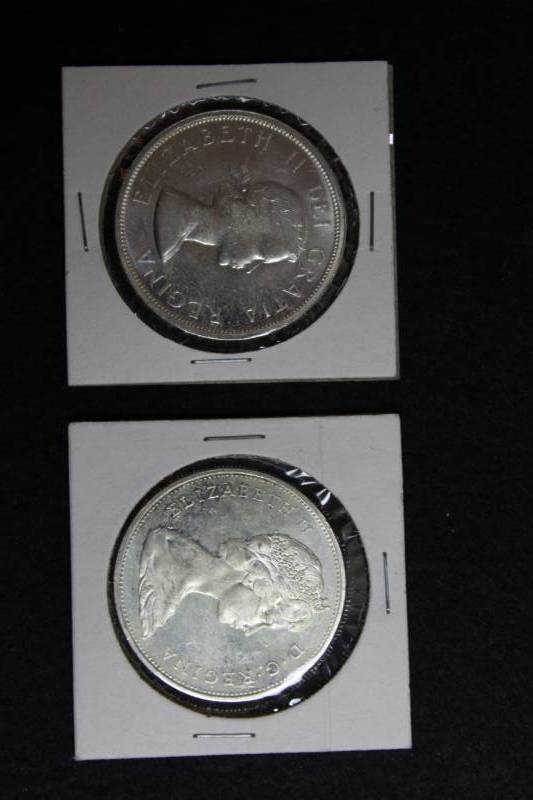 lot 21 image: Lot of (2) 1963 -1965  CANADA DOLLAR Coins,