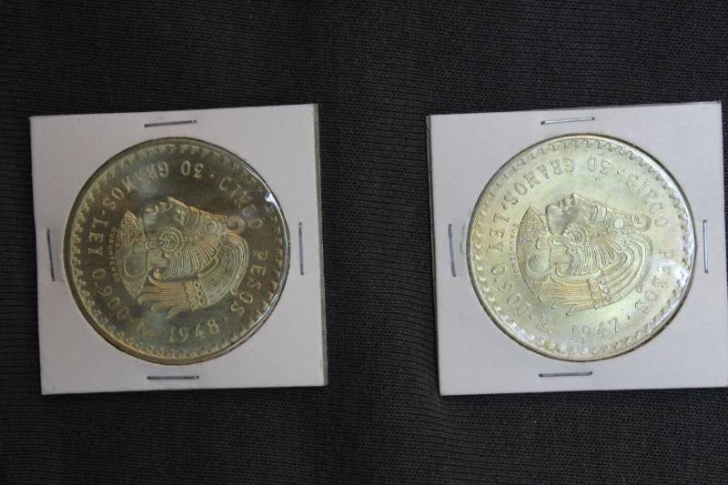 lot 32 image: Lot of (2) 1947-1948 Mexico Silver 5 Pesos Cuauhtemoc (ASW .8681 oz)