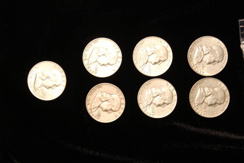 lot 103 image: Lot of (7) Pre 1964 Franklin Half Dollars
