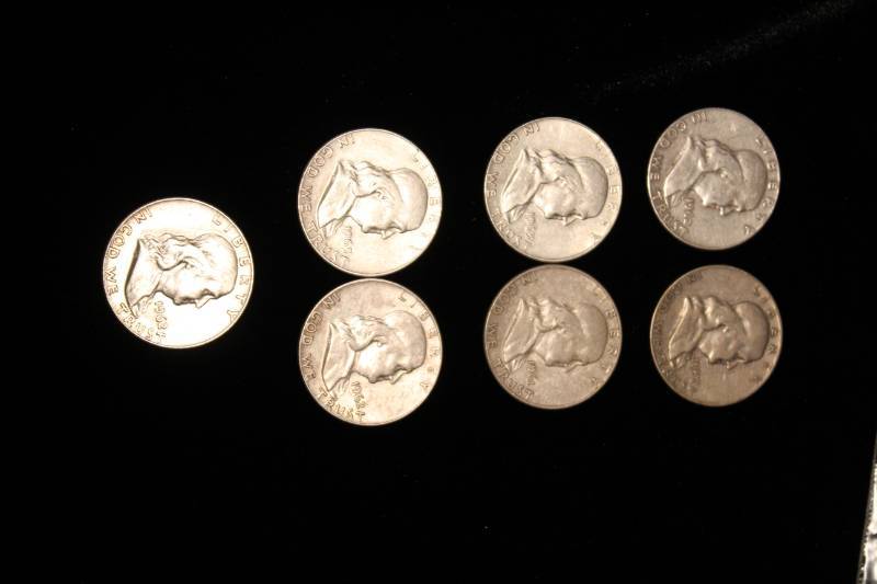 lot 104 image: Lot of (7) Pre 1964 Franklin Half Dollars