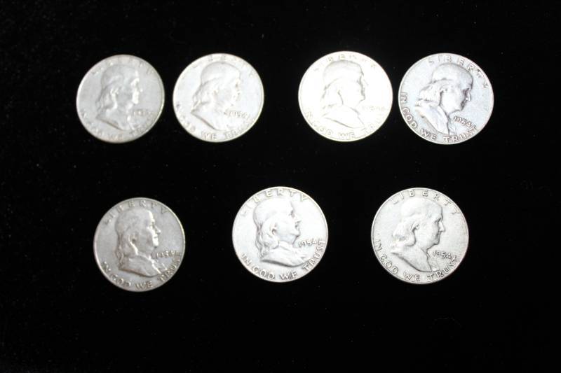 lot 113 image: Lot of (7) Pre 1964 Franklin Half Dollars