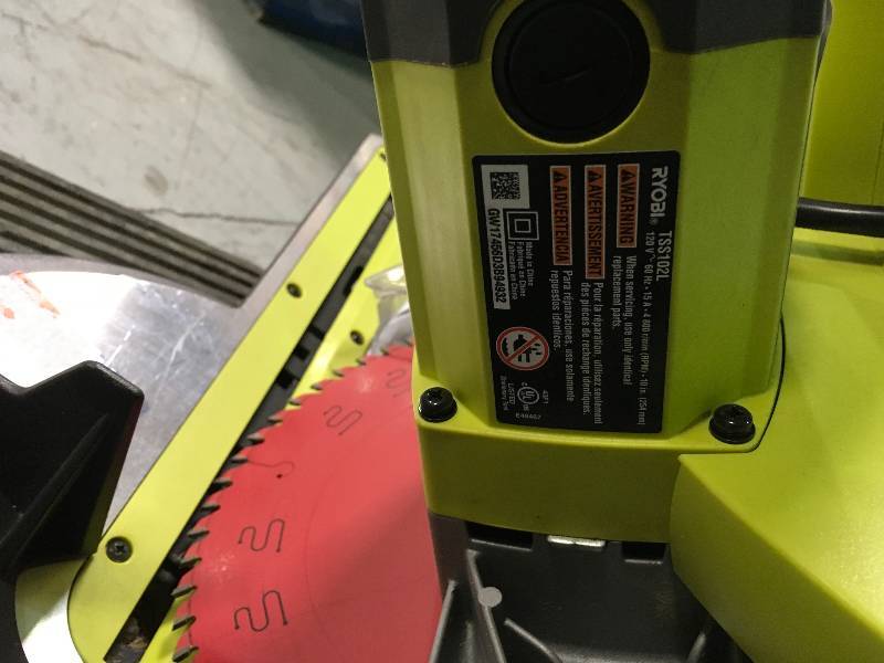 lot 24 image: Ryobi   15 Amp 10 in. Sliding Miter Saw with Laser  Used in good working cond. tool Only 4 wheels car are not include