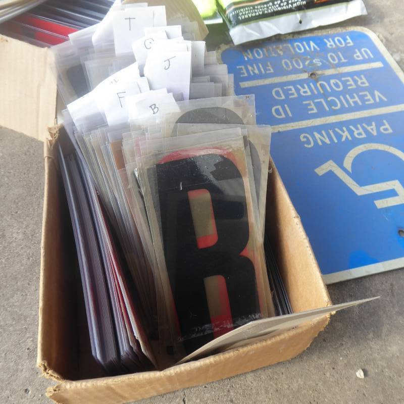 lot 89 image: Lot of Sign Letters, Safety Vests and Handicap Sign