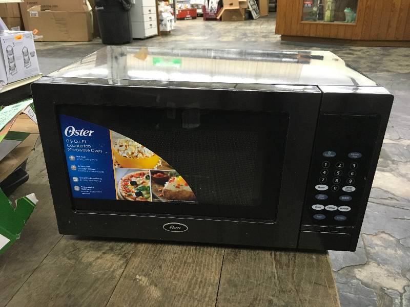 Oster .9 CUFT Black Stainless Steel Microwave Oven, Retail $54.99
