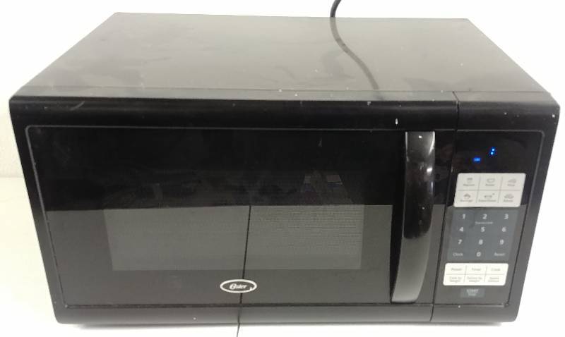 lot 76 image: Oster Microwave Oven