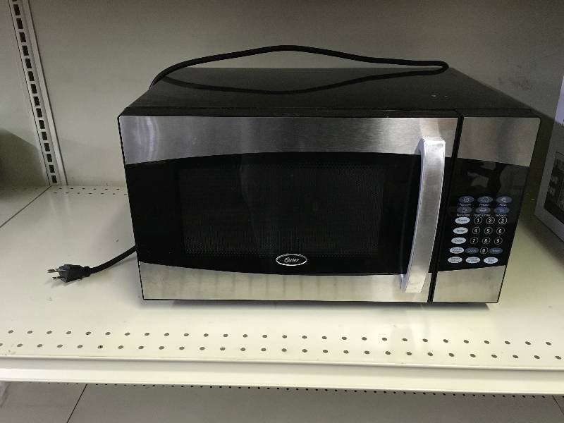 Sold at Auction: Oster Microwave Oven