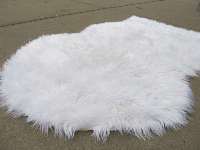lot 67 image: White Faux Fur RugWall Hanging