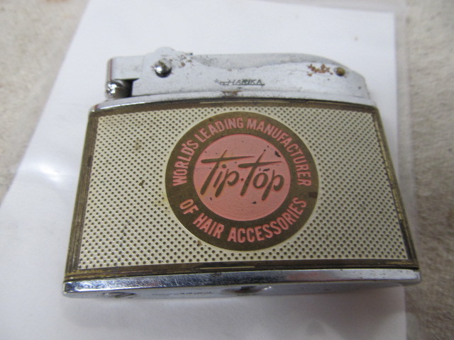 lot 107 image: Vintage TIP-TOP Hair Accessories Advertising Cigarette Lighter