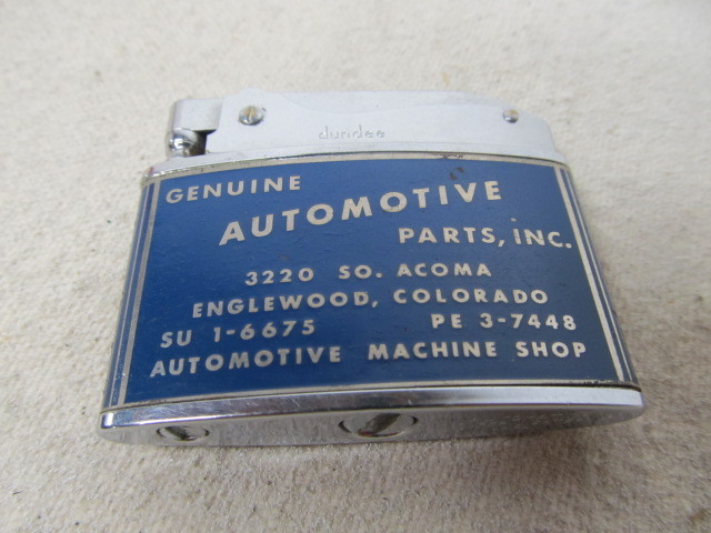 lot 108 image: Vintage Automobile Parts & Service Machine Shop Advertising Cigarette Lighter