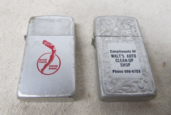 lot 110 image: Vintage Automotive Shop & Piston Rings Advertising Cigarette Lighters