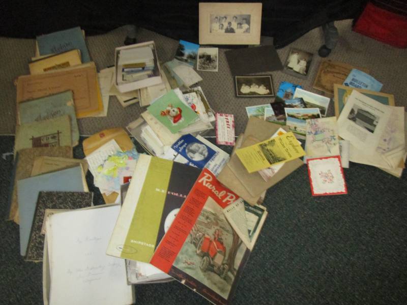 lot 9 image: Old letter, cards, black and white negatives, pictures, report cards, and lots of various famaily heritage stuff.